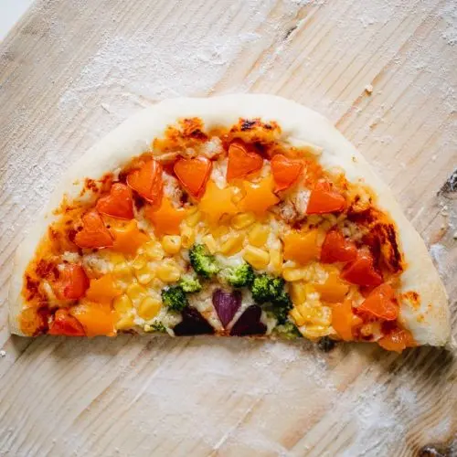 Rainbow pizza with veggie pizza toppings